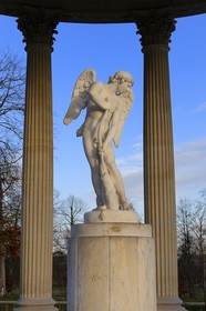 France, Yvelines, Chateau de Versailles, listed as World Heritage by UNESCO, Domaine de Marie Antoinette, the Petit Trianon Garden, the Love Temple, statue by Bouchardon called Cupid Cutting His Bow from the Club of Hercules