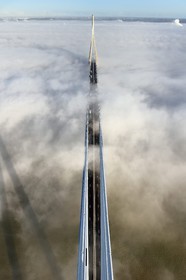 France, between  Calvados and Seine Maritime, the Pont de Normandie (Normandy Bridge) that emerges from the morning mist of autumn and spans the Seine, view from the top of the south pylon