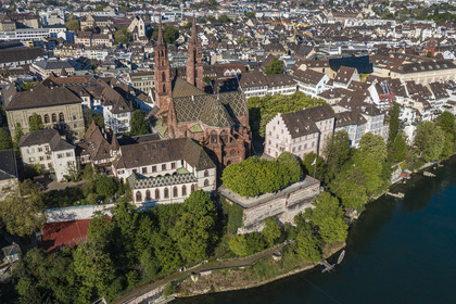 Switzerland, Basel, the left bank of the Rhine, the Minster or Protestant Cathedral of Our Lady of Basel (Munster) overlooking the Rhine and the old town (aerial view)