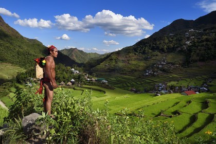 Philippines, Ifugao province, Banaue rice terraces around the village of Batad, listed as World Heritage by UNESCO, the guide Adolpho coated in the traditional Ifugao costume