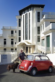 France, Pyrenees Atlantiques, Basque Country coast, Guethary, former art deco Guétharia hotel built in the 1920s turned into a residence, French journalist, writer and director Alain Gardinier driving his BMW Isetta