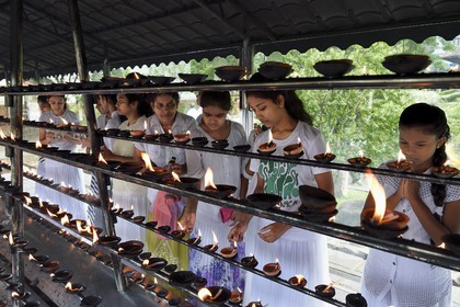 Sri Lanka, center province, Kandy, Temple of the Buddha Tooth (Sri Dalada Maligawa), place where the pilgrims are burning incense and oil in offering to Buddha