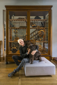 France, Paris, cartoonist and comic book author François Schuiten in his Parisian studio, with his dog Ulysses