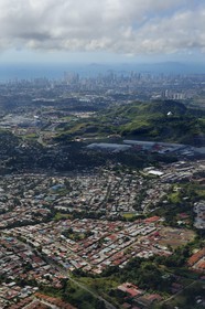 Panama, Panama City skyscrapers and its suburb in the foreground (aerial view)