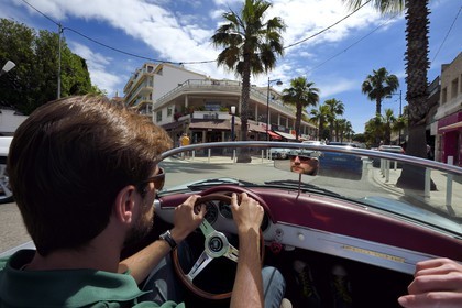 France, Alpes-Maritimes, Antibes,  Juan-les-Pins, avenue Guy de Maupassant aboard a collection convertible Porsche Speedster 356