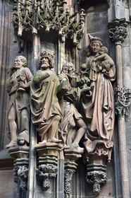 France, Bas Rhin, Strasbourg, old town listed as World Heritage by UNESCO, Notre Dame Cathedral, portal of Saint-Laurent in the north transept with the adoration of the biblical magi, left the Moor  wise man Caspar (magus) with at his feet a dog with long hair