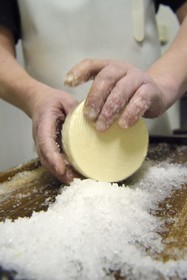 France, Haut Rhin, Wasserbourg, Ferme-auberge (farm-inn) Buchwald, marcaire Michel Wehrey in the production of munster AOP cheese (cow's milk), 24-hour Munster salting