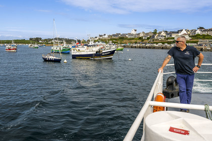 France, Finistère, Le Conquet, Penn ar Bed boat connecting with the islands of Molene and Ouessant, fishing boats in the background