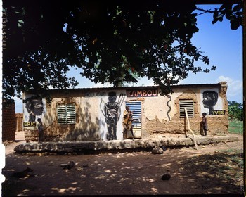 Burkina Faso, Poni province, Lobi land, Loropéni, Houliene Kambou with his little twin sons, wall painting by  artist Hans Bouman in 1992