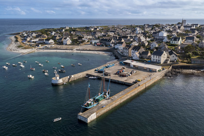 France, Finistère, Iroise Sea, Molene archipelago, Molene Island, the town and the ship Notre-Dame de Rumengol former barge at the quayside in the port (aerial view)