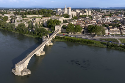France, Vaucluse, Avignon, the Saint-Bénézet bridge (Pont d'Avignon) on the Rhone river and the Palais des Papes (Palace of the Popes), listed as World heritage by UNESCO, in the background (aerial view)