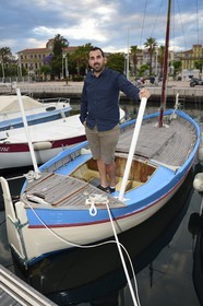 France, Alpes-Maritimes, Cannes, Jeremy Crunchant owner of the oldest Pointu (traditional boat) in the harbor