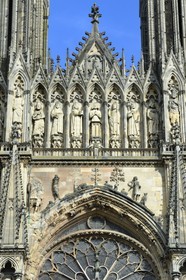 France, Marne, Reims, Notre-Dame de Reims cathedral, listed as World Heritage by UNESCO, the western facade, Baptism of Clovis (center) by the Bishop Saint Remi, in the presence of Clotilde, his wife and inspiration of his conversion, the Bishop assistants and of the hermit Montan
