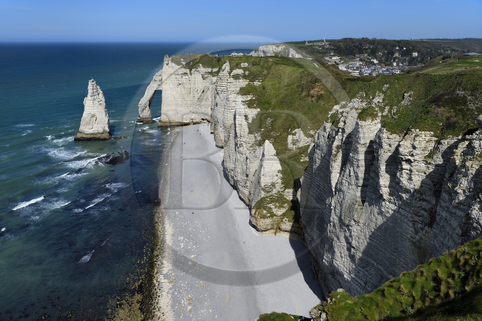 France, Seine-Maritime, Pays de Caux, Alabaster Coast (Cote d'Albatre), Etretat, the Aval cliff, the Arch and the Aiguille (Needle) d'Aval, in the background the town of Etretat
