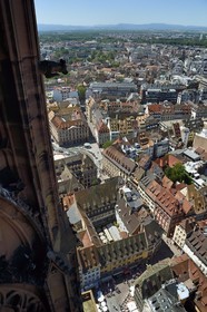 France, Bas Rhin, Strasbourg, old town listed as World Heritage by UNESCO, Notre Dame Cathedral, the octagonal tower overlooking the place de la cathedrale in the foreground and the place Gutenberg in the center, the Vosges in the background