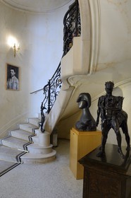 France, Alpes Maritimes, Cannes, the Villa La Californie where Picasso lived, today renamed the Pavillon de Flore by Marina Picasso, the main staircase, Photo of Pablo Picasso young in the main staircase, Picasso sculpture (bust of woman Marie-Therese) and Cesar in the foreground
