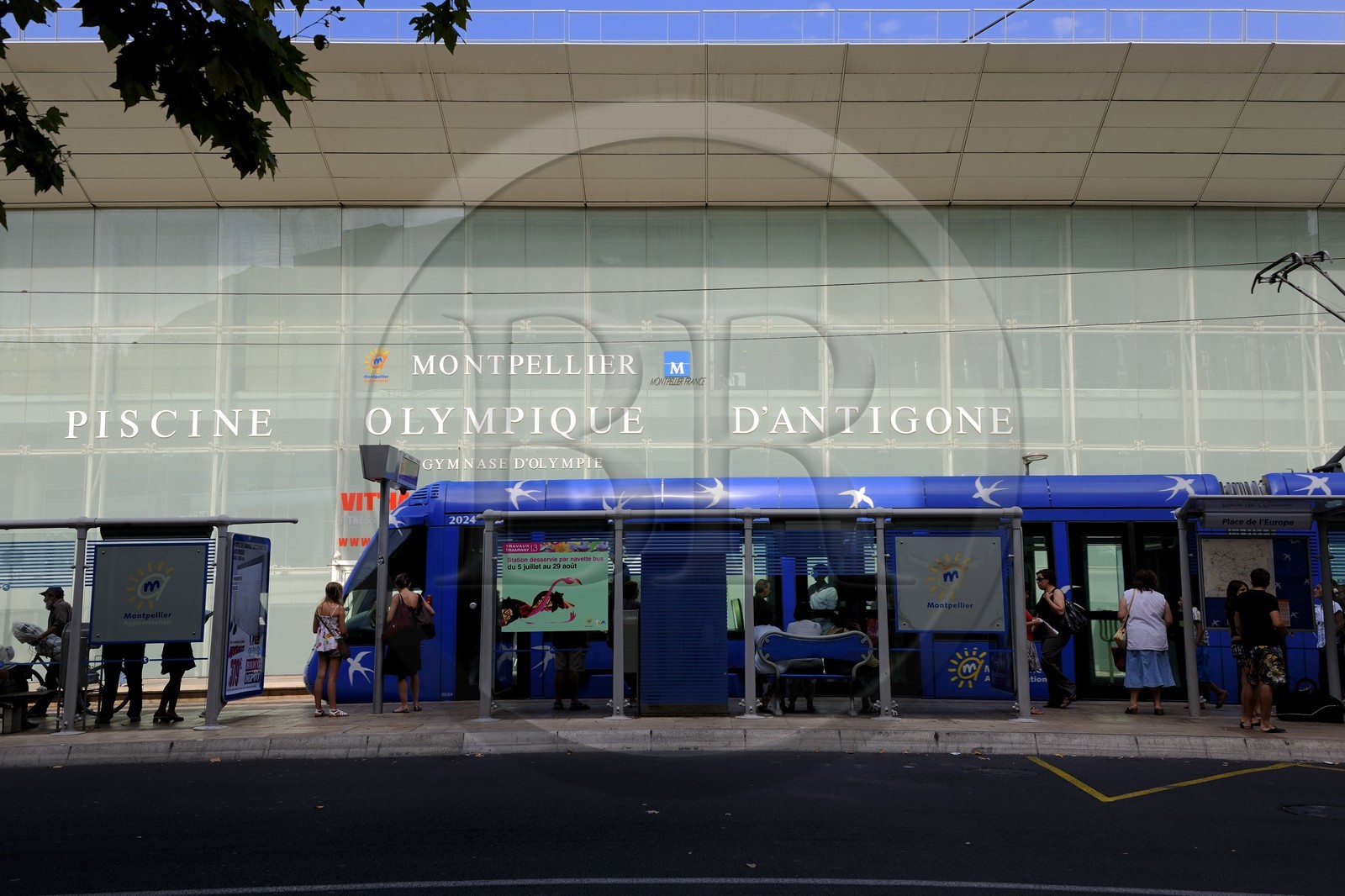 France, Herault, Montpellier, Antigone District by the architect Ricardo Bofill, Olympic-size swimming pool and the tramway