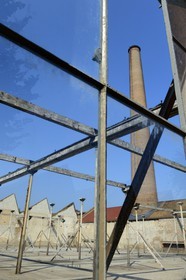 France, Haut Rhin, Mulhouse, partially deserted buildings of the DMC (Dollfus-Mieg and Company) textile company, the factory and a brick chimney