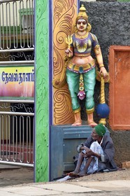 Sri Lanka, Central Province, city of Matale, beggar at the entrance of a Hindu temple