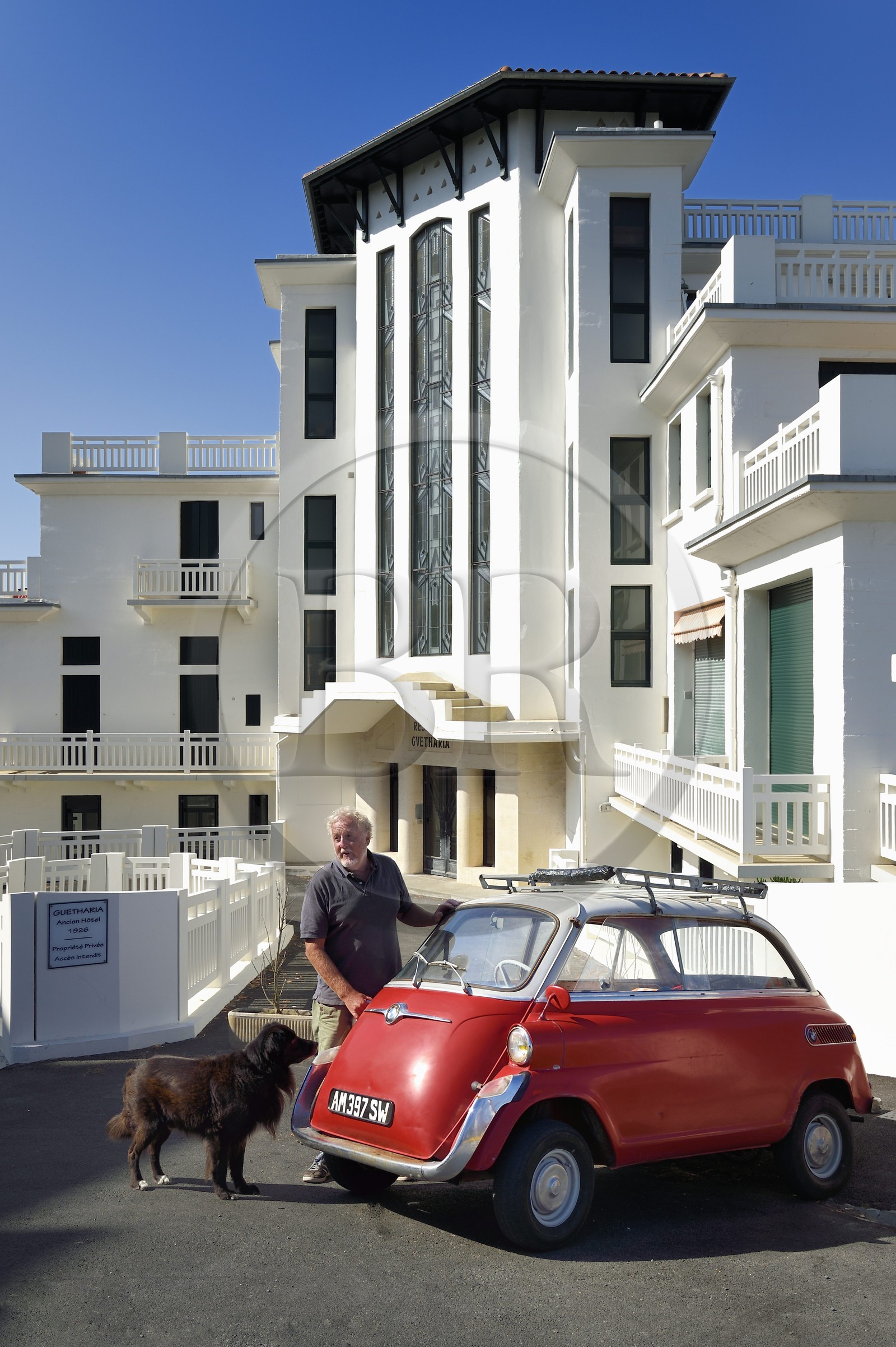 France, Pyrenees Atlantiques, Basque Country coast, Guethary, former art deco Guétharia hotel built in the 1920s turned into a residence, French journalist, writer and director Alain Gardinier driving his BMW Isetta