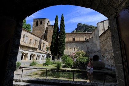 France, Herault, Medieval town of Saint-Guilhem-le-Desert, a stop on el Camino de Santiago, pilgrimage route to Compostela, labelled Les Plus Beaux Villages de France (The Most Beautiful Villages of France), abbey of Gellone from the 11th century listed as World Heritage by UNESCO, the cloister