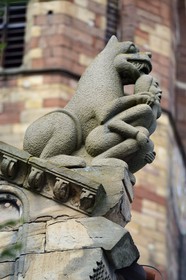 France, Bas Rhin, Rosheim village, St-Pierre and St-Paul roman Church, the lustful sculpture acroterion symbolizes sin, a naked woman appears crushed by a threatening lion