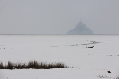 France, Manche, Mont Saint Michel, listed as World Heritage by UNESCO, under the snow