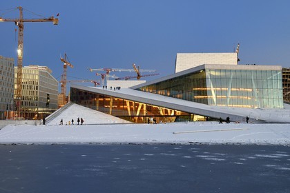 Norway, Oslo, the Opera under the snow, designed by the architecture firm Snohetta (including Tarald Lundevall) on the commercial and industrial port of Bjorvika district undergoing restructuring