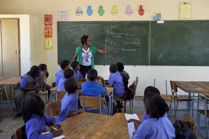 Namibia, Erongo region, Damaraland, the Spitzkoppe in the Namib Desert, Katora Primary School, in the class 4 classroom (around 11 years), the teacher Monalisa Seibes teaches Khoisan languages with click consonants
