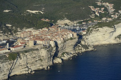 France, Corse du Sud, Bonifacio, the limestone cliffs with the staircase of the King of Aragon, the citadel and the old town (aerial view)