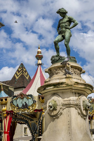France, Cote d'Or, Dijon, area listed as World Heritage by UNESCO, Bareuzai fountain topped with the bronze sculpture The Harvester Treading the Grapes