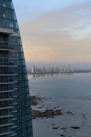 Panama, Panama City, Grand Tower building and the new district of skyscrapers at Costa del Este in the background