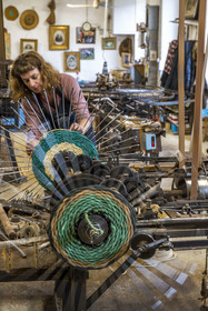 France, Drome, Drome provencale, Nyons, La Scourtinerie, the last scourtin factory in Provence, traditional filters used in the production of olive oil but also designed today as decorative objects made of coconut fiber, manufacturing of scourtins in their workshop on custom-made circular looms