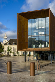 France, Cote d'Or, Dijon, area listed as World Heritage by UNESCO, International Cité of Gastronomy and Wine by architect Anthony Béchu, the light cannon that houses the Ferrandi school, the Great Chapel of the former general hospital in the background