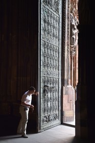 France, Bas Rhin, Strasbourg, old town listed as World Heritage by UNESCO, Notre Dame Cathedral, Sacristan Michel Bolli opens the main door of the Western facade in the early morning