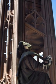 France, Bas Rhin, Strasbourg, old town listed as World Heritage by UNESCO, Notre Dame Cathedral, halfway up each of the four spiral staircases called the Vier Schnecken (four snails), a footbridge connects them to the octagonal tower and there are two statues, here one of the two characters holding a phylactery