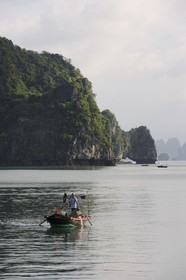 Vietnam, Quang Ninh Province, Halong Bay, listed as World Heritage by UNESCO, fishing boat