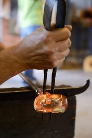 France, Moselle, Meisenthal, Centre international d'Art verrier (CIAV) (international glass centre), making of a christmas bowl made of glass, blowpipe put on a bench called «gamin mecanique»