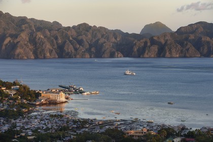 Philippines, Calamian Islands in northern Palawan, Coron Island, Coron Town and Coron Island Natural Biotic Area in the background