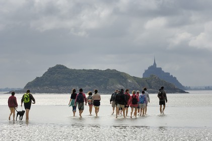 France, Manche, crossing on foot the Bay of Mont Saint Michel, listed as World Heritage by UNESCO