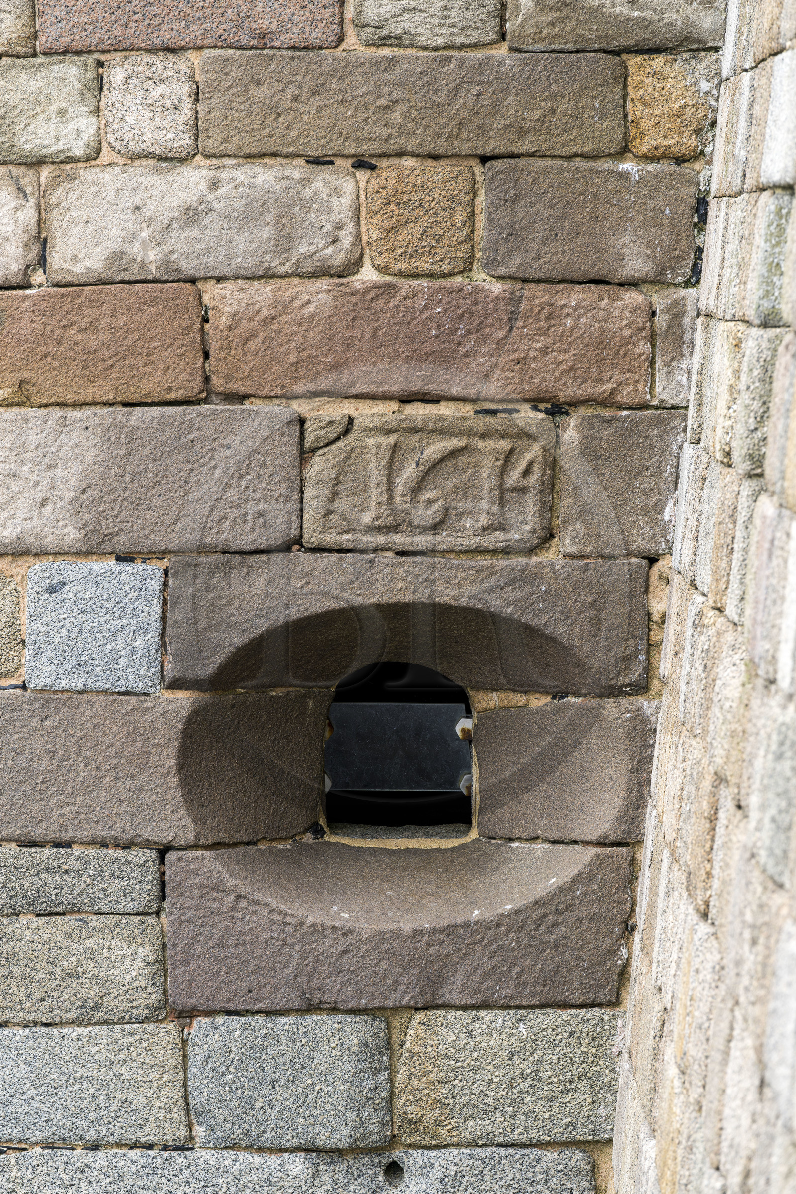 France, Finistère, Morlaix bay, Plouezoc'h, the Taureau castle built by Vauban in the 17th century, cannon muzzle and stone dated from the construction