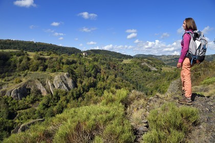 France, Haute Loire, Loire river Valley, Lafarre, hiker observing the stronghold of Cros de Lafarre above the gorges of La Langougniole, tributary of the Loire