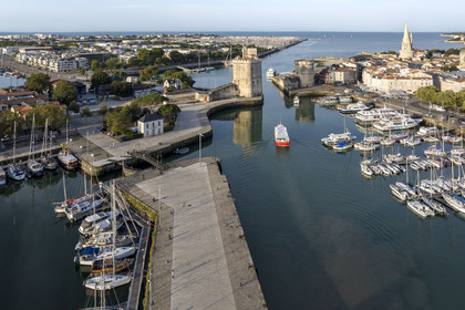 France, Charente Maritime, La Rochelle, the Old Port, Tour Saint Nicolas and Tour de la Chaine protect the entrance to the Old Port, the tour de la Lanterne in the background (aerial view)