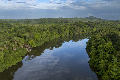France, French Guiana, Kourou, the carbet (shelter) at Camp Maripas on the banks of the Kourou river, Monkey Mountain (161 meters high) in the background (aerial view)
