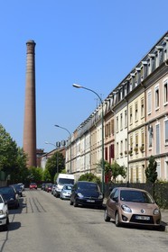 France, Haut Rhin, Mulhouse, a brick chimney of the textile company DMC (Dollfus-Mieg et Compagnie) on rue de Pfastatt at the end of the rue de Sampigny