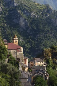 France, Alpes-Maritimes, Roya Valley (Nice hinterland), at the foot of the Mercantour National Park, perched village of Saorge, Saint-Sauveur (St. Saviour) church overlooks the valley