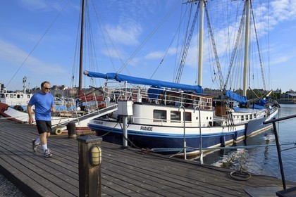 Sweden, Stockholm, island of Skeppsholmen, old boats moored at Östra Brobänken