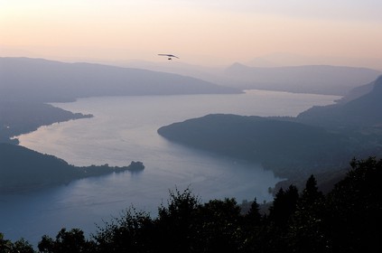 France, Haute Savoie, hang glider flying over Annecy lake