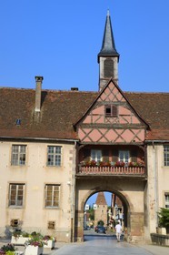 France, Bas Rhin, Rosheim village, General de Gaulle street, School gate and Virgin gate in the background