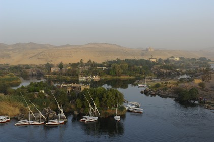 Egypt, Upper Egypt, Nubia, Nile Valley, Aswan, islets of the first cataract and the Agha Khan mausoleum in the background on the western bank